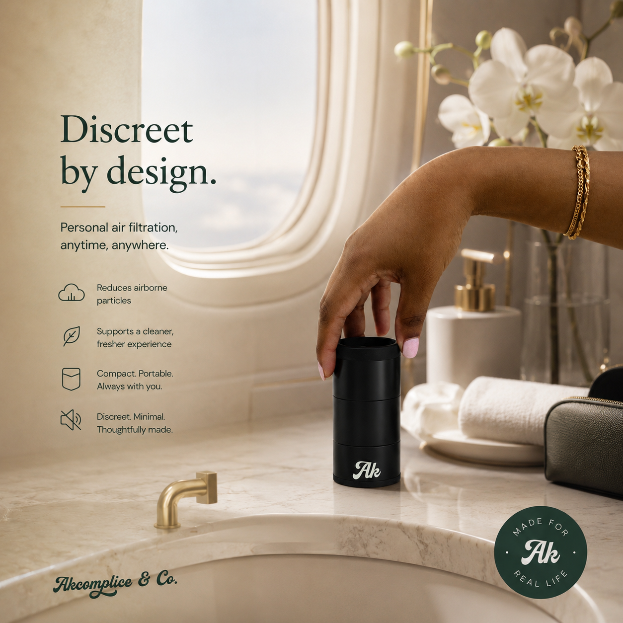 Hand holding a black air filtration device on a bathroom counter with text about its features.