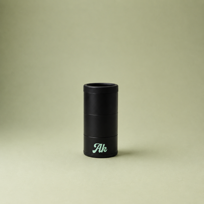 Black cylindrical object with 'Ak' branding on a beige background